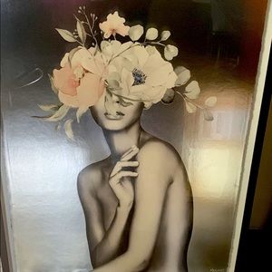 Black framed picture of woman with floral arrangement head partly nude silver